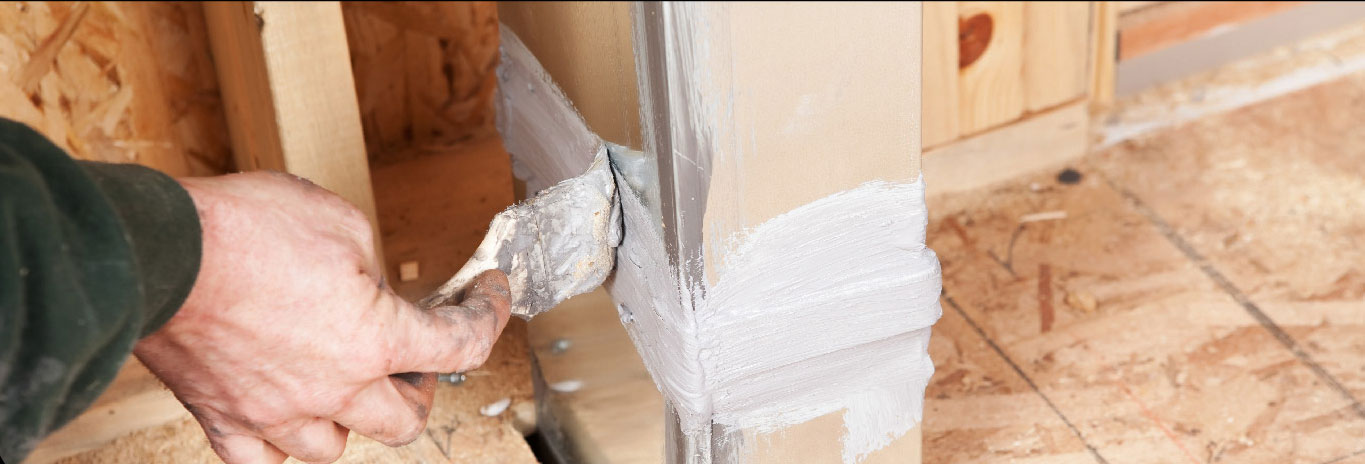 Man insulating his attic ducts